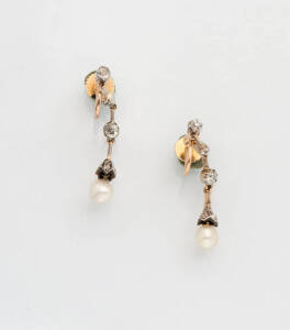 A pair of pearl and diamond drop earrings. Screw fittings. 9ct yellow gold and silver.