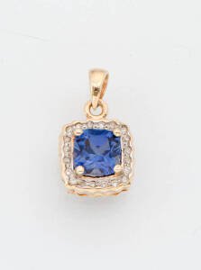 A diamond and tanzanite pendant. 9ct yellow gold.