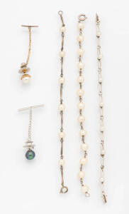Assorted pearl jewellery including bracelets and tie pins.