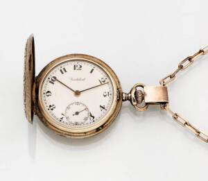 A silver pocketwatch on chain.