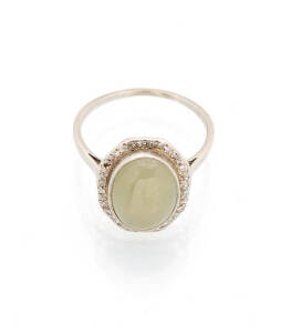 A jade and diamond dress ring. Platinum.