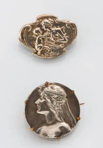 Two silver figural brooches.