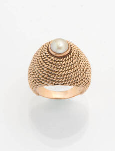 A gold and pearl dress ring. 18ct yellow gold. Weight 13.23 grams