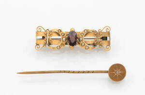 A pearl and red stone brooch. 9ct yellow gold and a boxed stone set stick pin.&nbsp;