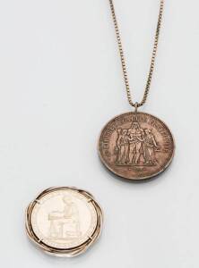 &nbsp;A French silver coin pendant and chain and a silver Portuguese coin pendant.&nbsp;