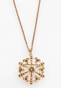 An Edwardian seed pearl pendant. Yellow gold.