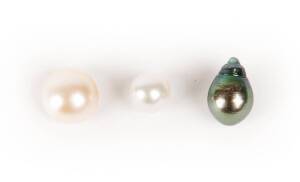 &nbsp;Three loose Broome pearls.