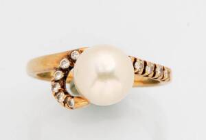 A pearl and diamond ring. The single pearl in a diamond scroll setting. 14k gold. Size M&frac12;.
