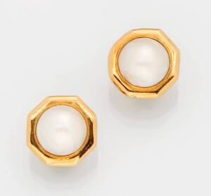 A pair of mabe pearl earclips. 18ct yellow gold.