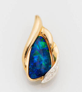 &nbsp;An opal and diamond pendant. 14k yellow gold.