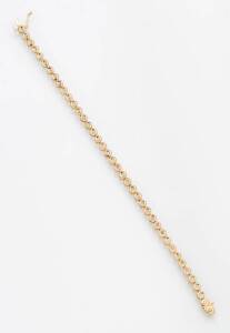 A diamond line bracelet, set with 38 diamonds. 9ct Yellow gold.
