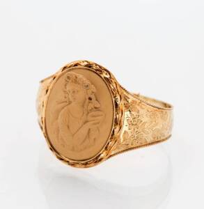 A Victorian lava cameo bangle. 9ct yellow gold.