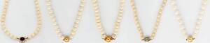 Five strands of cultured and freshwater pearls. 9ct and 14ct clasps.