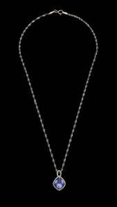 A diamond and tanzanite pendant on chain. 18k white gold.&nbsp;