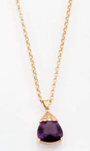 A pear shape amethyest and diamond pendant on chain. 14k yellow gold.