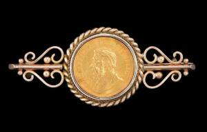 A "Pound coin" brooch. 18ct yellow gold. Weight 23gm.