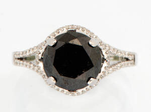 A contemporary black and white diamond ring. 18k white gold.&nbsp;