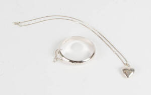 A sterling silver bangle and heart pendant.