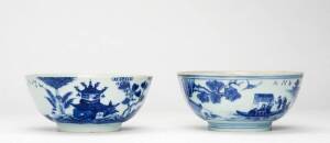 Two Chinese blue and white bowls, 18th century, one painted with ships and a castle and inscribed, the second with a similar design, seal mark to base, 17.4cm diameter