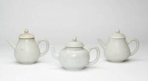 Three Chinese Dehua teapots, from a shipwreck, 18th century, 10cm and 11cm high&nbsp;