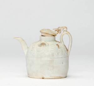 A Qingbai ewer and cover, Yuan Dynasty, 1279-1368, with a moulded floral band, 9cm high