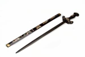 A Vietnamese ceremonial sword with polished wood blade, the sheath and handle inlaid with mother of pearl, 80cm long