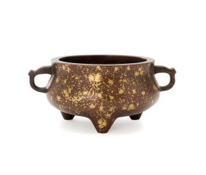 A Chinese gold-splashed censer, supported on three short feet, an archaic mark under the base, 8cm high, 13cm diameter