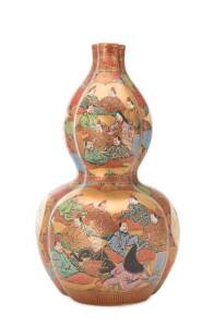 A Japanese double-gourd shaped Kutani vase, Meiji period, 1868-1912, decorated with figures, four character seal mark to base, 36cm high