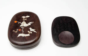 An inscribed Chinese inkstone in a mother of pearl inlaid hardwood box, 20.5cm long