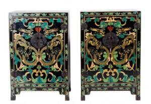 A pair of Chinese 2 door cabinets. Black lacquer and painted finish with dragon motif, 20th century. Height 92cm, width 61cm, depth 30cm