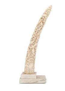 Chinese ornate carved ivory tusk mounted on later marble base, late 19th century. Tusk 44cm