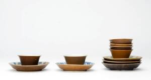 Six Chinese teabowls and five blue and white saucers, Kangxi, early 18th century, each teabowl and saucer brown-glazed to the outside, all from a shipwreck, teabowls 6.5cm diameter, saucers 11cm diameter variable