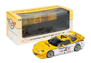 Road Tough: Chevrolet Corvette (1957) 1:18 scale model, new in box; 1964 Chevrolet Corvette Grand Sport, new in box; Auto Art Corvette C5-R 2000, new in box. (3 items).