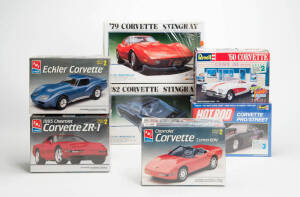 A collection of 1:24 and 1:25 Corvette scale model kits, all in boxes and mostly still sealed. Makers include Revell (11), A.M.T. (8), Monogram (6) and others. (Total: 32).