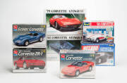 A collection of 1:24 and 1:25 Corvette scale model kits, all in boxes and mostly still sealed. Makers include Revell (11), A.M.T. (8), Monogram (6) and others. (Total: 32).