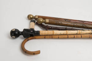 WALKING STICKS: Group of 6 walking sticks including two that turn into billiard cues, 20th century