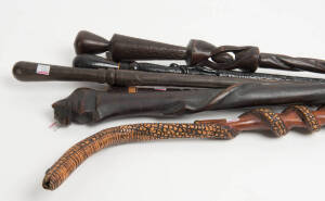 WALKING STICKS: Group of 6 carved tribal walking sticks, 20th century.