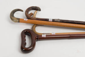 WALKING STICKS: Group of 6 antique walking sticks including silver collars, horn handles & ebony examples, late 19th to early 20th century
