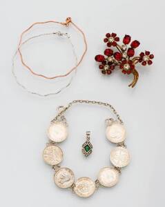 A collection of jewellery including a silver coin bracelet, a paste brooch and pendant and two 9ct gold bracelets.&nbsp;