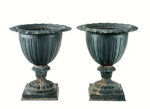 A pair of cast iron leaf form garden urns, French, 19th century. 50cm high