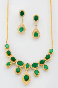 An emerald and diamond suite comprising a pendant necklace and earrings. 18ct yellow gold.