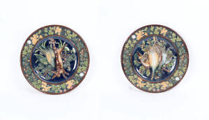 Pair of 19th century majolica circular plaques. Diameter 39cm each