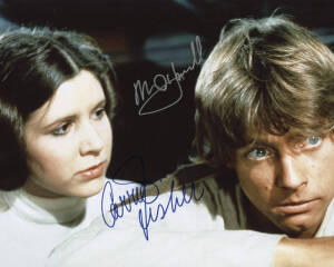 STAR WARS: AUTOGRAPHS: Collection of autographs from the original film series on photos and flyers featuring Carrie Fisher and Mark Hamill on attractive still; several cast on still of space battle scene and more.