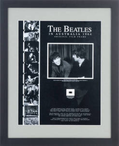 THE BEATLES IN AUSTRALIA 1964 - ORIGINAL FILM FRAME: Display with original 16mm film frame, with enlarged print of image, "George Harrison and John Lennon during The Beatles first Australian press conference at the Sheraton Motor Hotel Sydney 11 June 1964