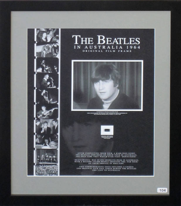 THE BEATLES IN AUSTRALIA 1964 - ORIGINAL FILM FRAME: Display with original 16mm film frame, with enlarged print of image, "John Lennon during The Beatles first Australian press conference at the Sheraton Motor Hotel Sydney 11 June 1964", window mounted, f