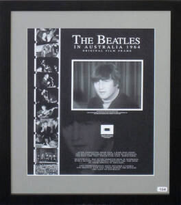 THE BEATLES IN AUSTRALIA 1964 - ORIGINAL FILM FRAME: Display with original 16mm film frame, with enlarged print of image, "John Lennon during The Beatles first Australian press conference at the Sheraton Motor Hotel Sydney 11 June 1964", window mounted, f