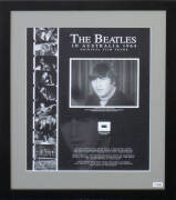 THE BEATLES IN AUSTRALIA 1964 - ORIGINAL FILM FRAME: Display with original 16mm film frame, with enlarged print of image, "John Lennon during The Beatles first Australian press conference at the Sheraton Motor Hotel Sydney 11 June 1964", window mounted, f