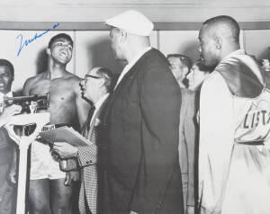 MUHAMMAD ALI, signed b/w photograph of Ali at weigh-in with Sonny Liston, size 51x41cm. With CoA.