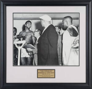 MUHAMMAD ALI, signed photograph "The Weigh In, Muhammad Ali vs Sonny Liston, February 25th 1964" (signature with some fading), window mounted, framed & glazed, overall 70x68cm.