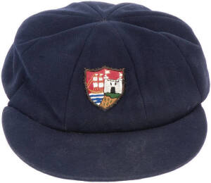 GLOUCESTERSHIRE CRICKET CAP, blue wool, Gloucestershire logo embroidered on front, made by Shaheen, named inside to "P.Bainbridge". G/VG condition. [Phil Bainbridge played 324 First-Class matches for Gloucestershire 1977-90 & Durham 1992-96].